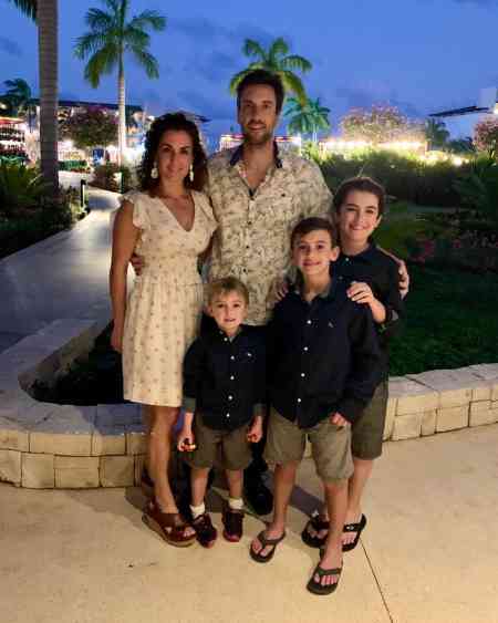 Clay travis with his wife and son 